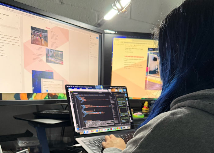 Jackie coding JKC Wellness' website