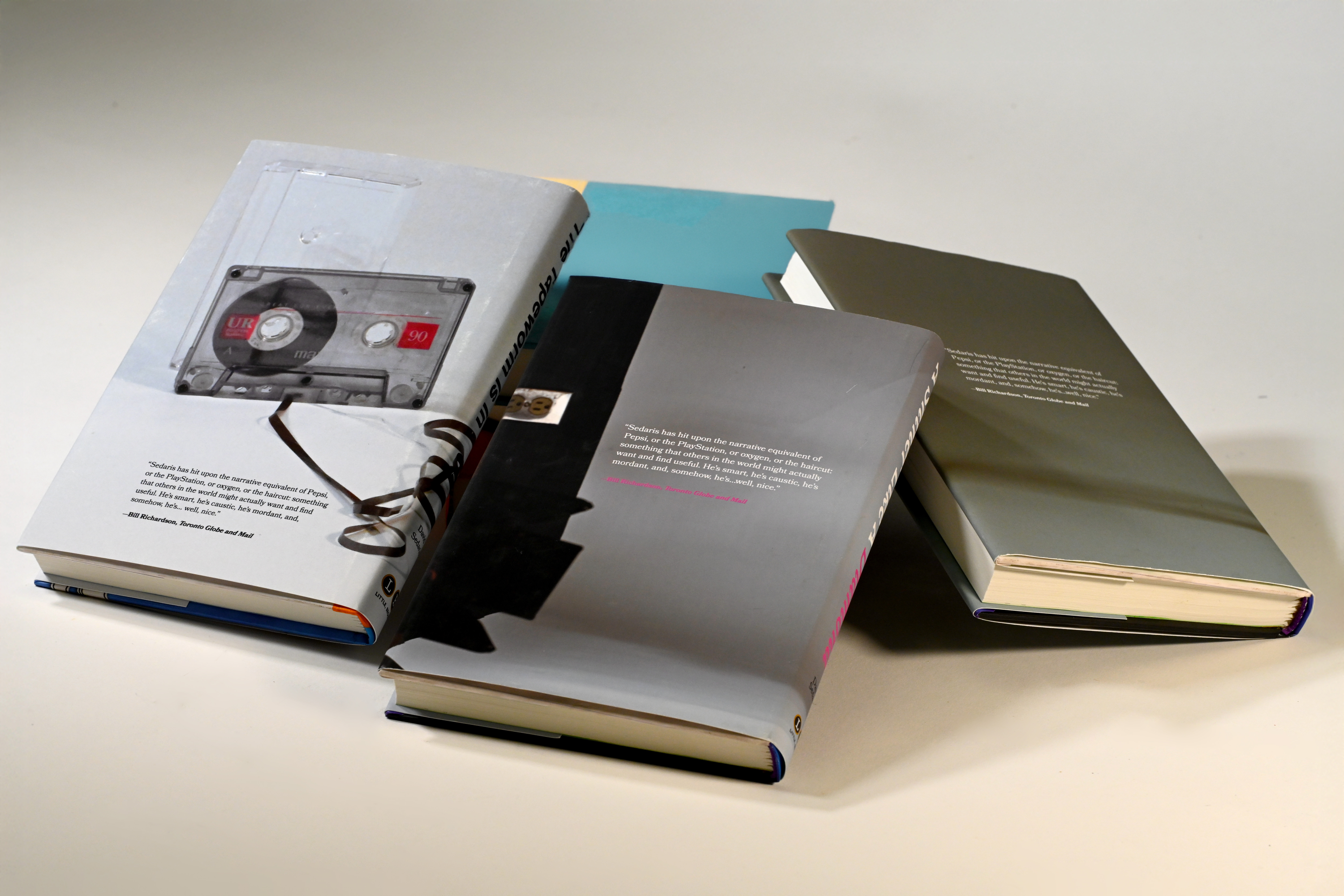 image of the back of 3 bookcovers